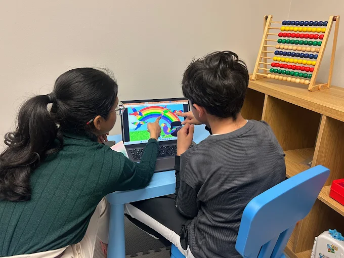 Therapist working with child at Roots and Tales Clinic