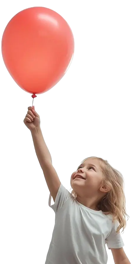 Happy child holding a red balloon